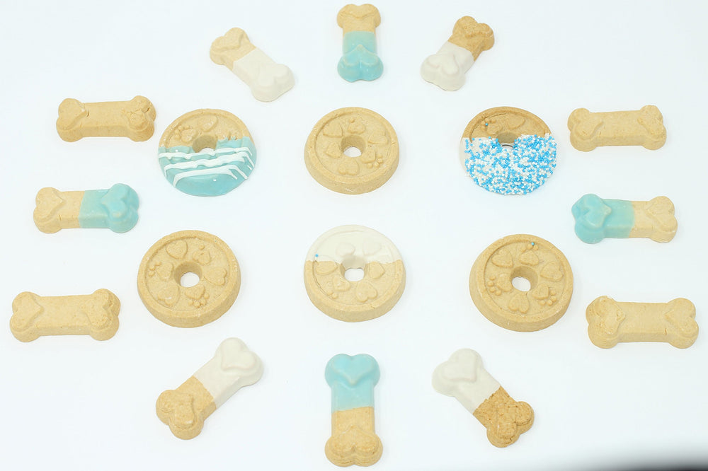 Claudias Canine Bakery blue buddies treats closeup features hand-decorated cookies with appealing aroma