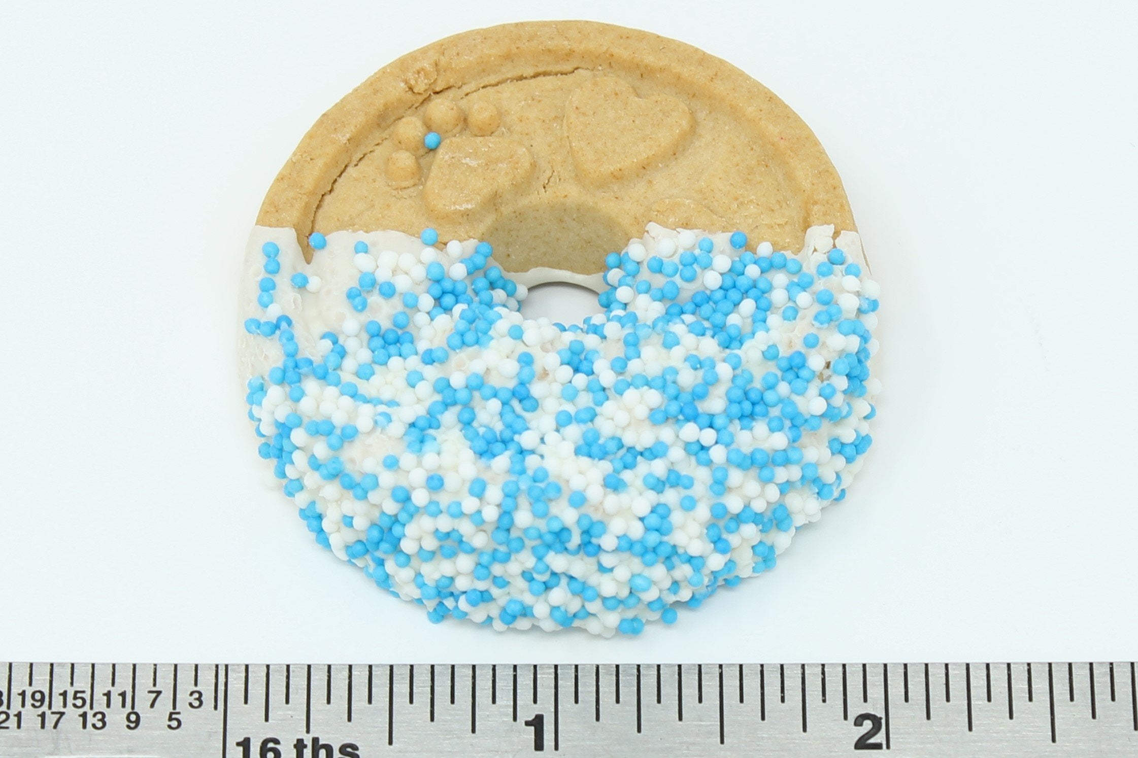 Claudias Canine Bakery gold paw bow detail highlights gift-worthy presentation and premium ingredients