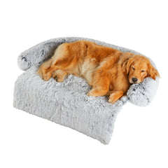 Codi Large Calming Dog Bed on a couch offers a secure lounging spot for anxious dogs.