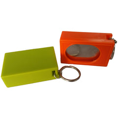 CRMADA box clicker in hand showing palm-friendly design for training