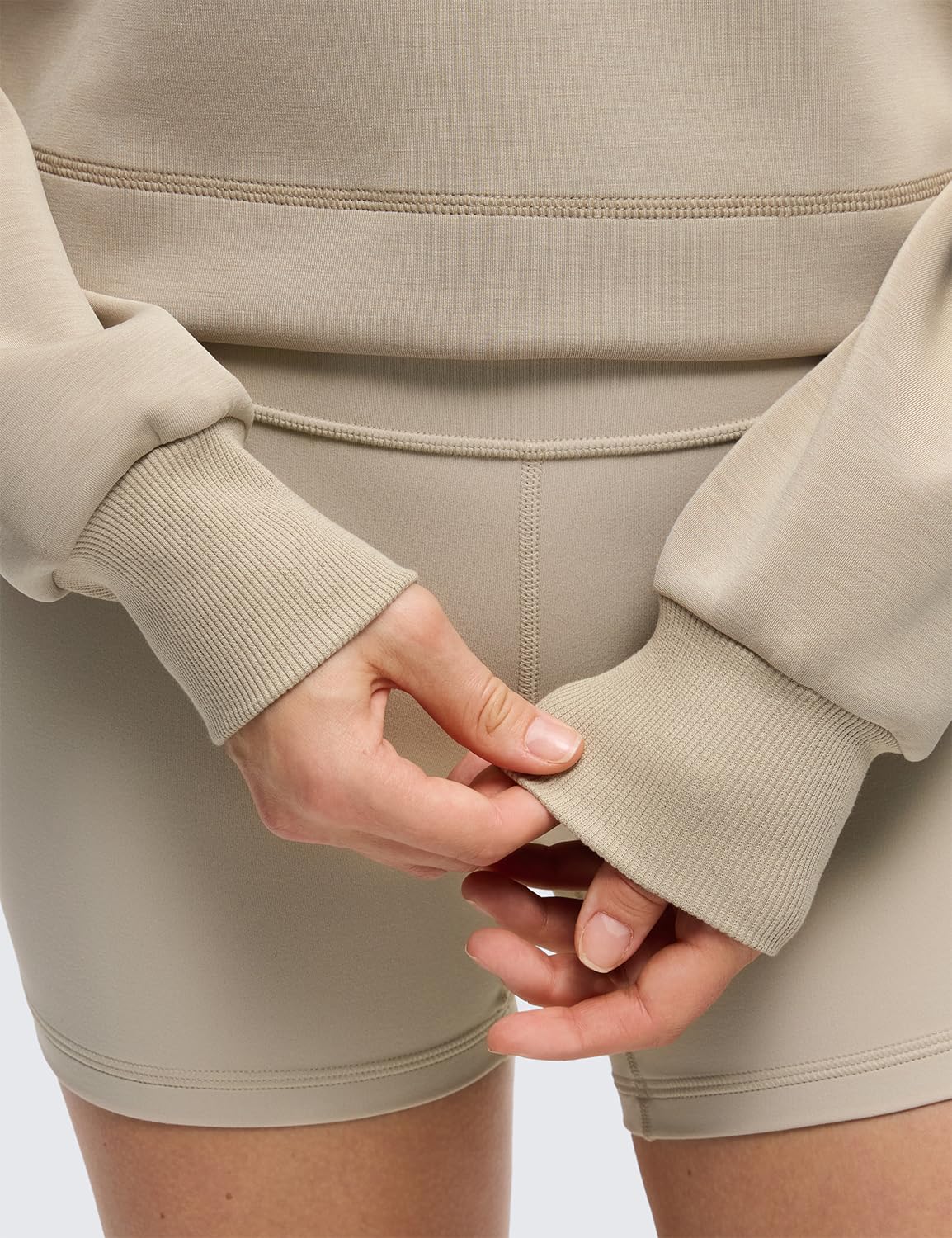 CRZ YOGA SoftAura lifestyle shot demonstrates cozy layering for lounging or workouts.