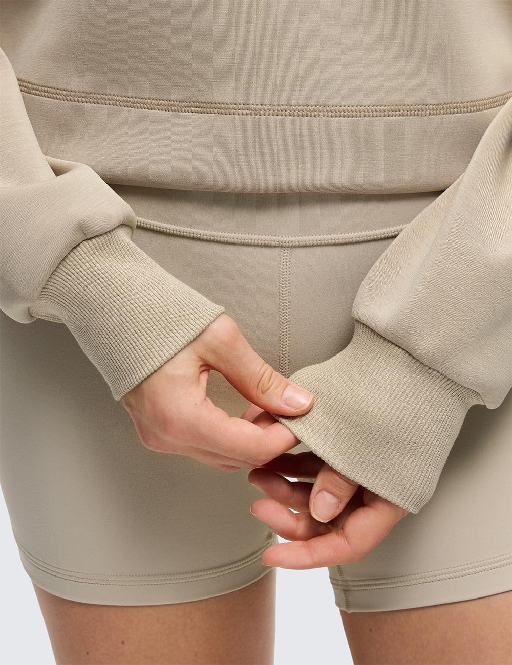 CRZ YOGA SoftAura lifestyle shot demonstrates cozy layering for lounging or workouts.