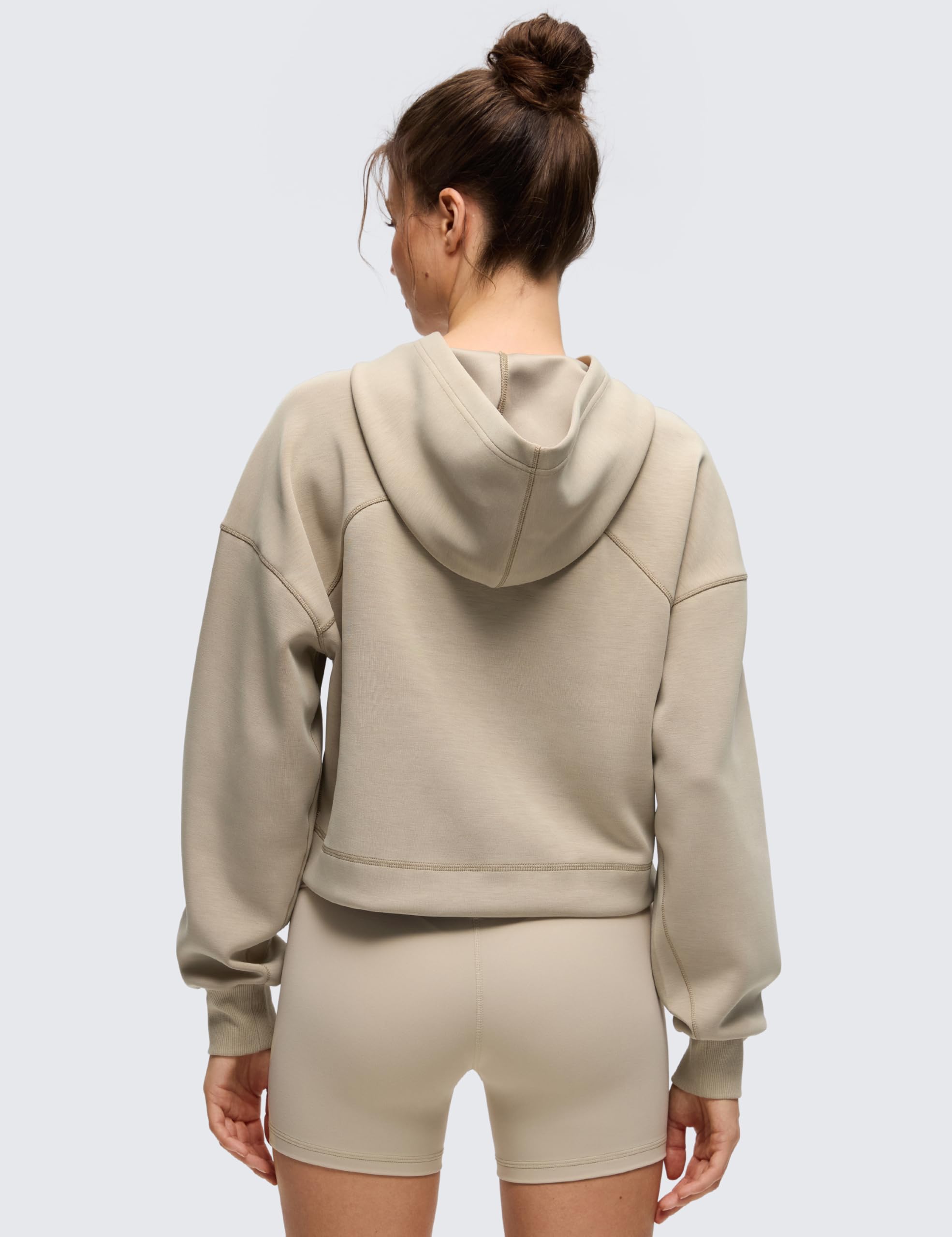 CRZ YOGA SoftAura cropped hoodie back view highlights relaxed fit and casual style.