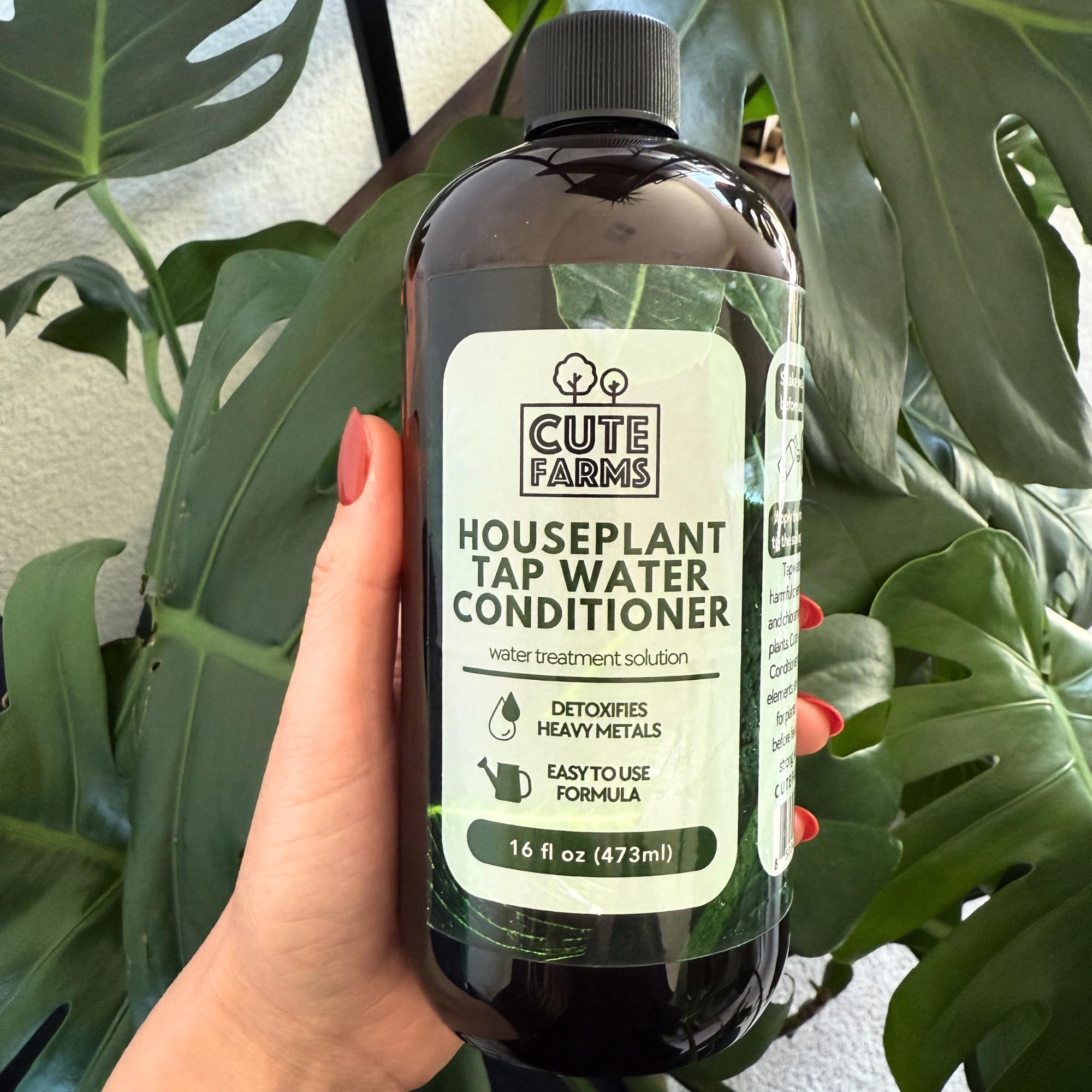 Cute Farms plant-enthusiast setup features conditioner bottle for healthy foliage.