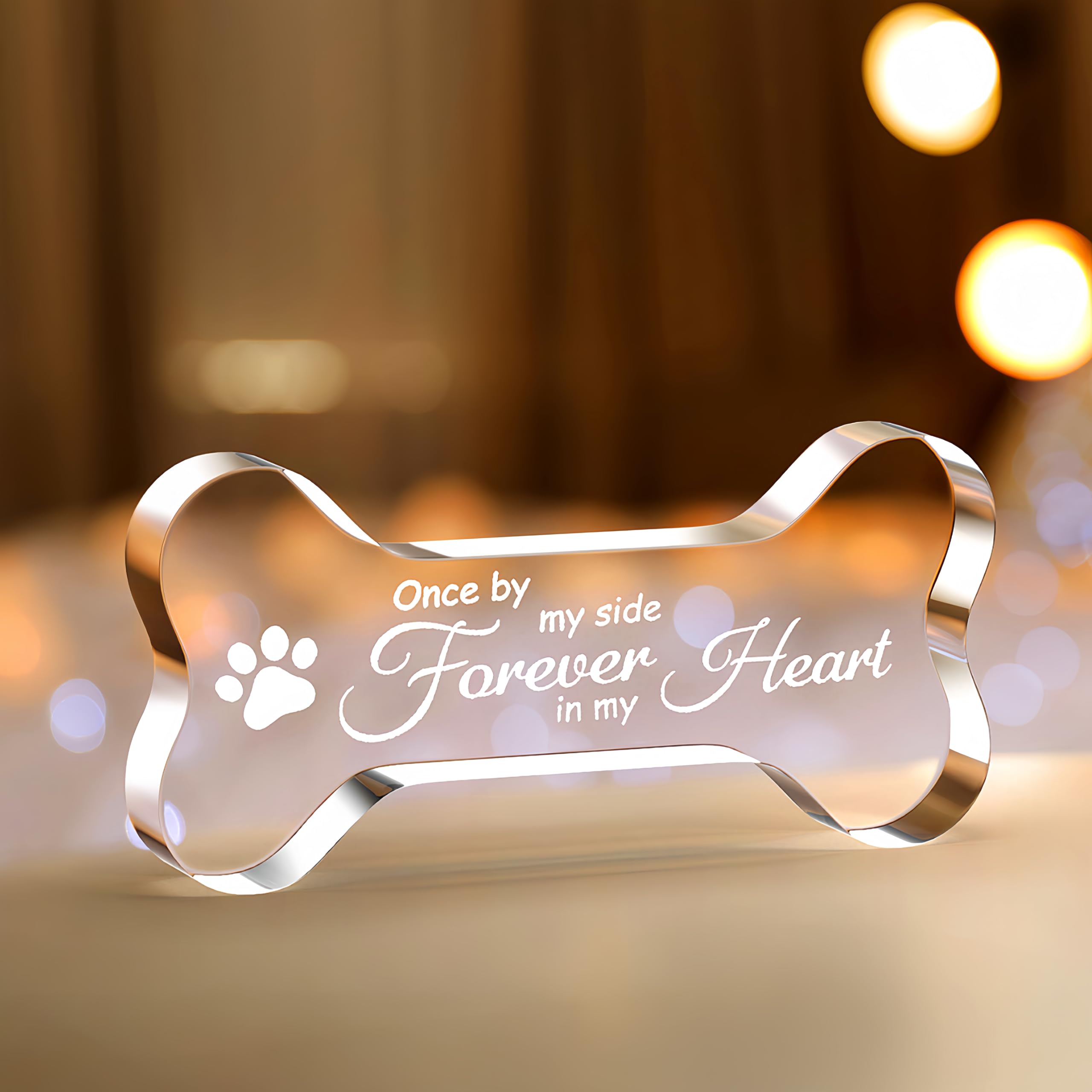 Cynlsum pet memorial ornament crystal bone shape glows in sunlight for keepsakes.