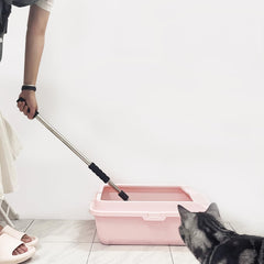 Depets pala para arena de gato con mango ajustable para mayor comodidad.