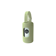 Diggs poop bag dispenser in sage attached to leash for quick one-hand cleanup.
