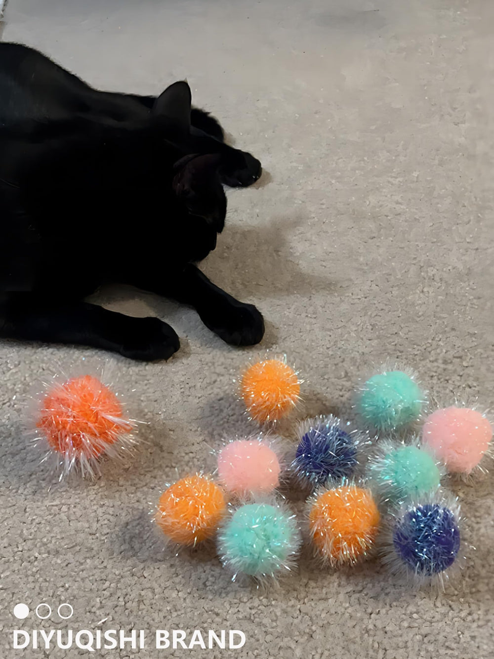 DIYUQISHI cat play action image with balls in motion encouraging exercise.
