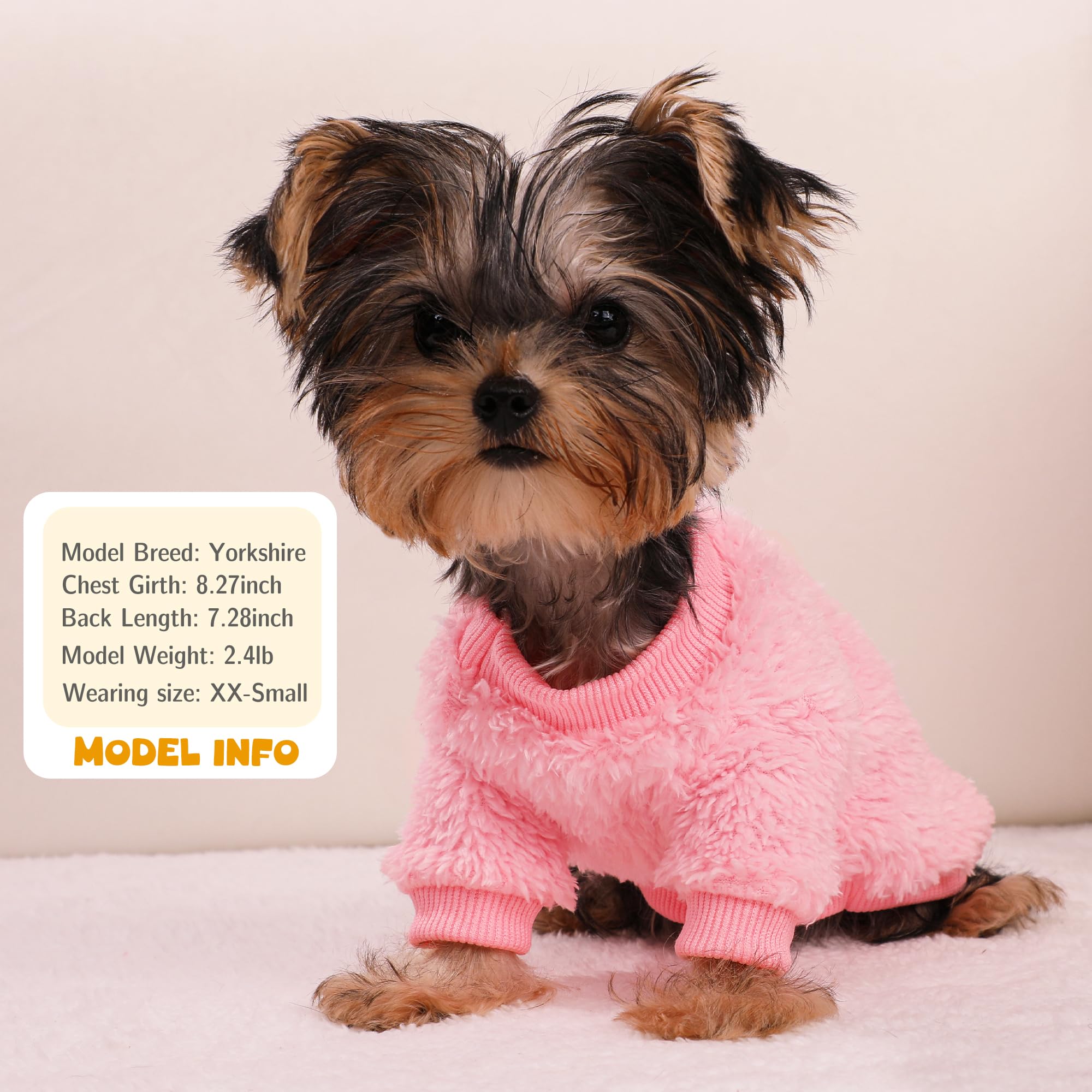 Dog Sweater pink fabric close-up highlights soft, fluffy fleece texture.