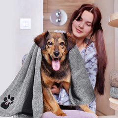 Dogvingpk towel drying a dog after swimming for home use.