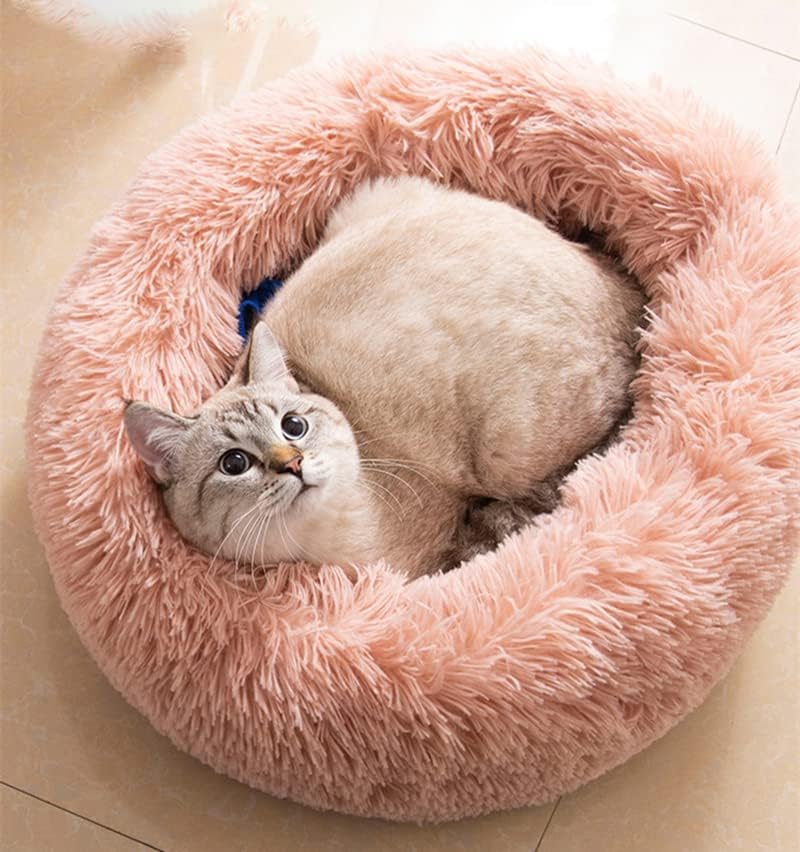 Donut pet bed round pink plush fur for cozy naps.