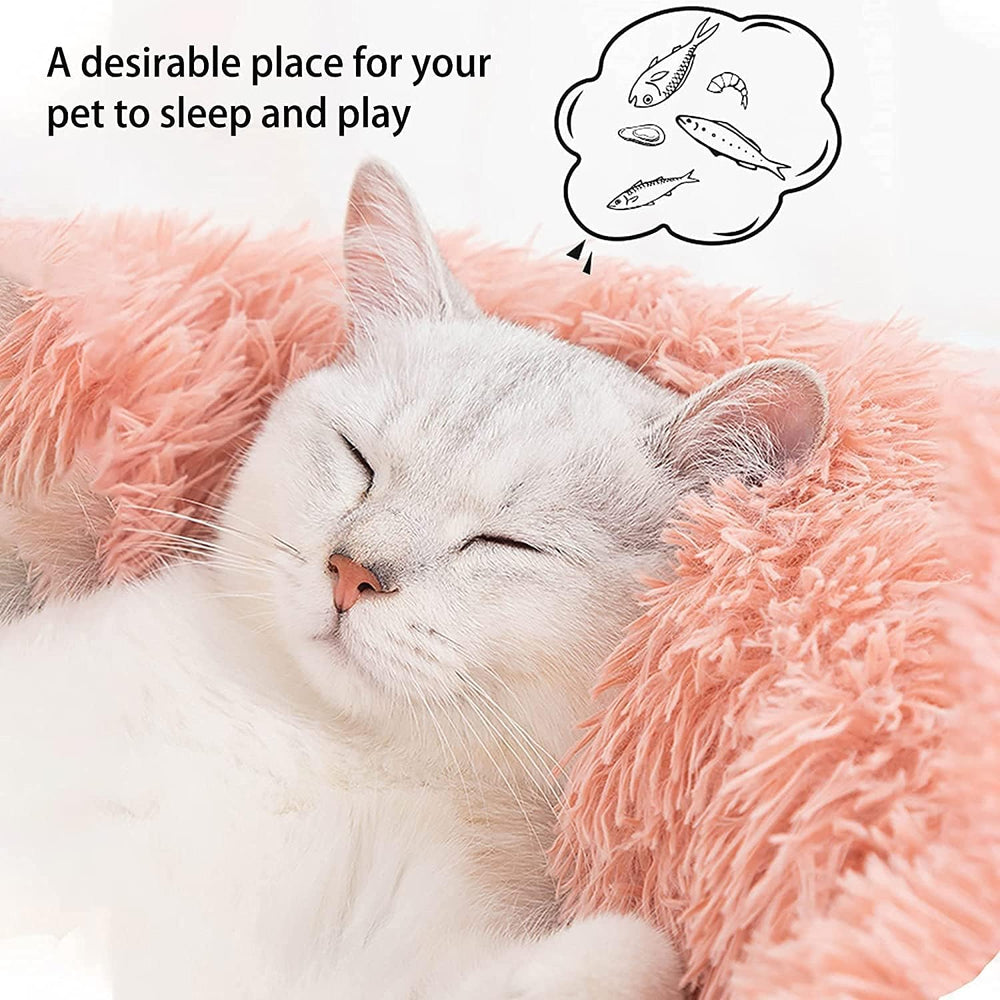 Donut pet bed round pink with raised edge for head and neck support.