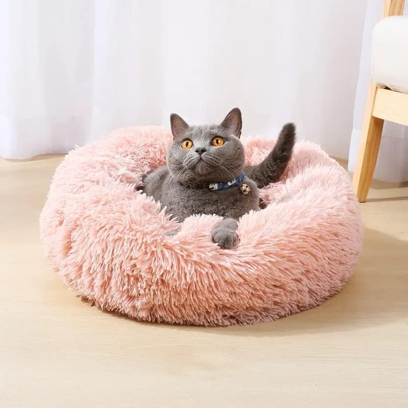 Donut pet bed nesting comfort for curling sleepers at night.