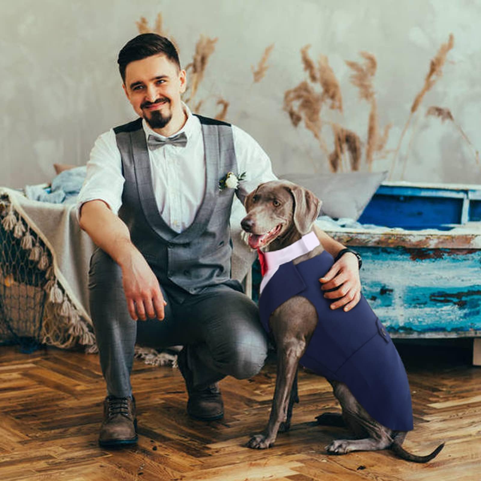 DORA BRIDAL dog tuxedo on a pet at a wedding setting.