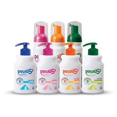 Douxo S3 Calm Itch Relief mousse tube being applied on pet's skin for gentle relief.