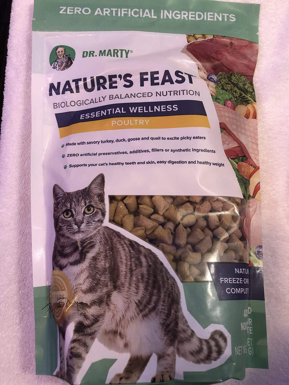 Dr. Marty Nature's Feast essential wellness poultry dry cat food packshot highlighting high-protein, low-carb nutrition for energy