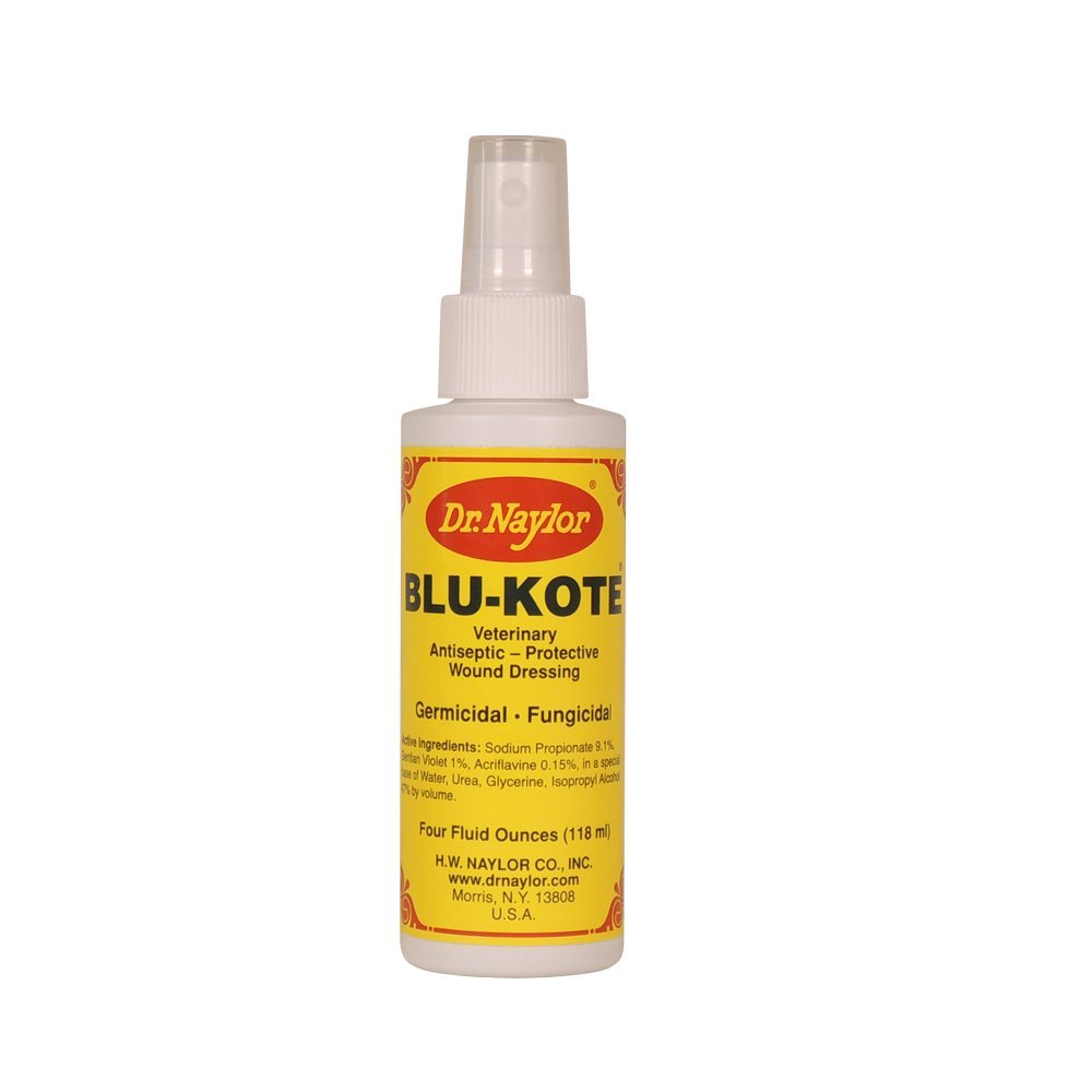 Dr. Naylor Blu-Kote Pump Spray applying blue antiseptic coating to wound for quick drying