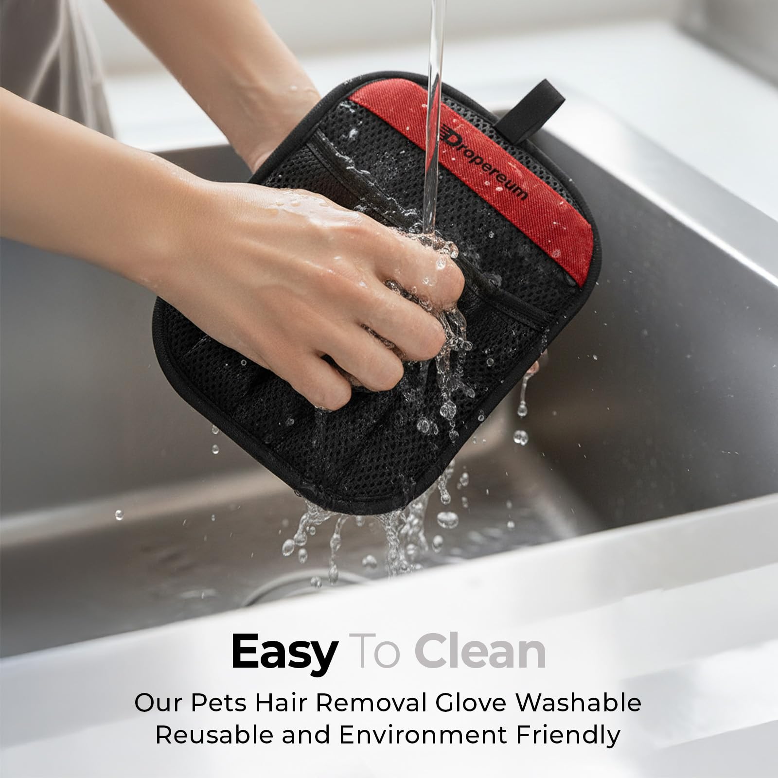 Dropereum glove used on car seat fabric to remove pet hair efficiently.