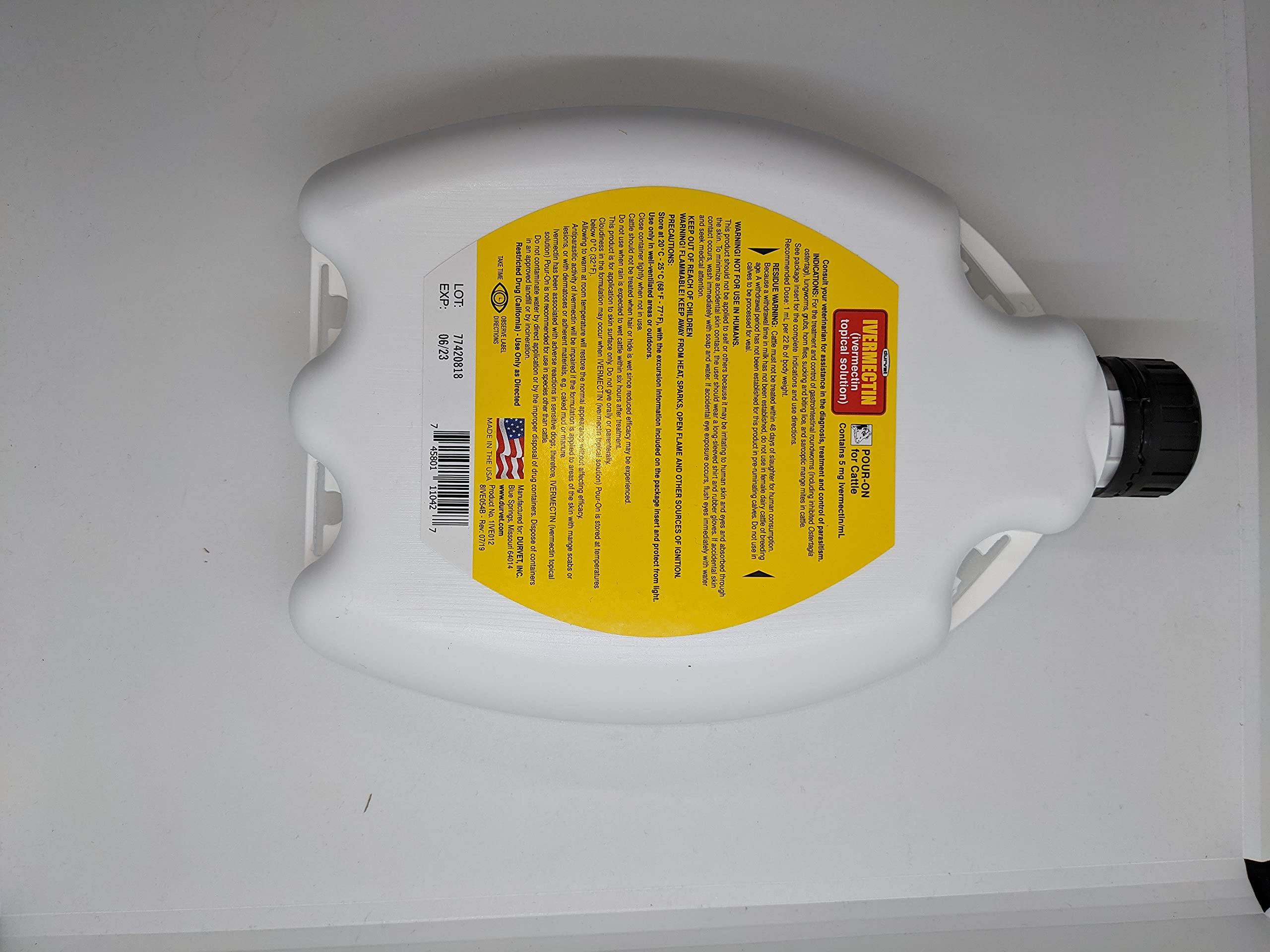 Durvet Ivermectin Pour-On bottle with safety label signals responsible use.