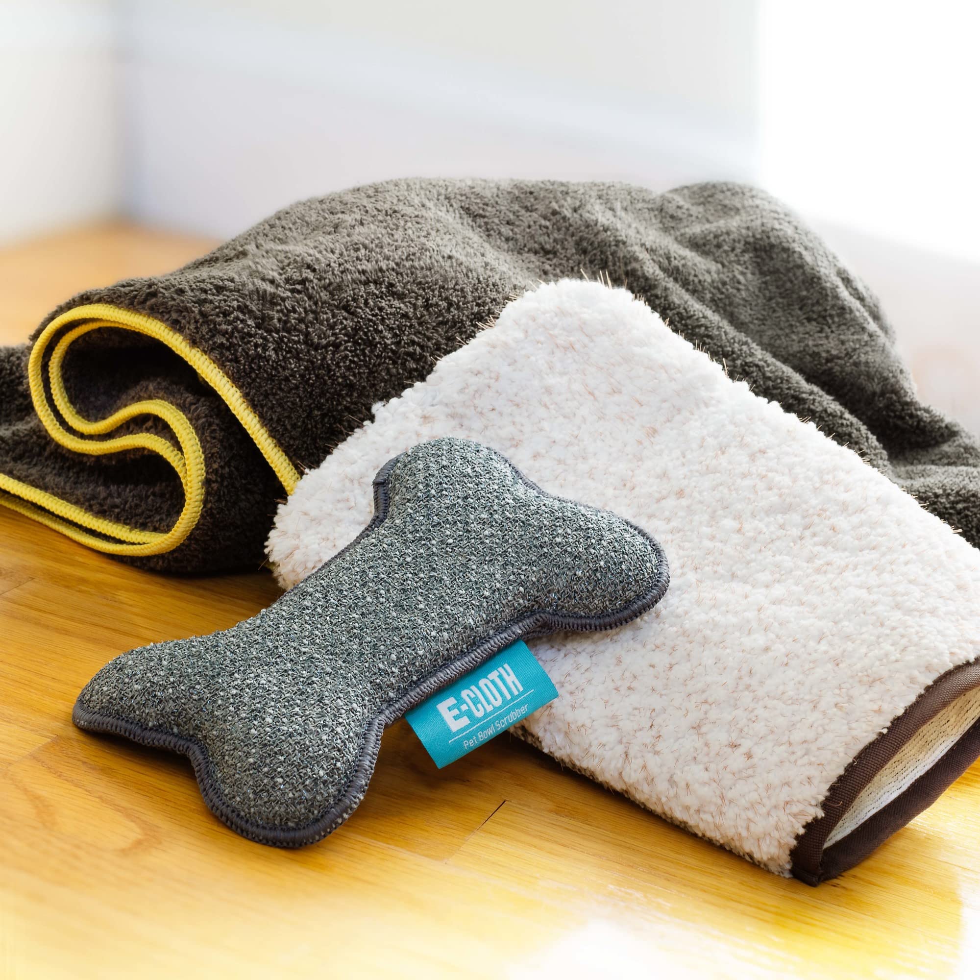 E-Cloth Pet Bowl Scrubber dampened with water cleans bowls fast