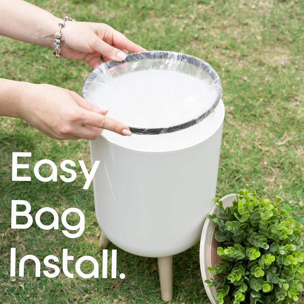 Earth & Mango plant-styled outdoor trash can complements garden furniture while concealing waste.