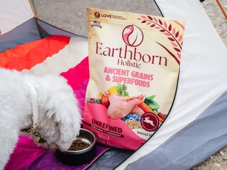 Earthborn Holistic Unrefined Roasted Rabbit feeding scene shows dogs enjoying daily meals