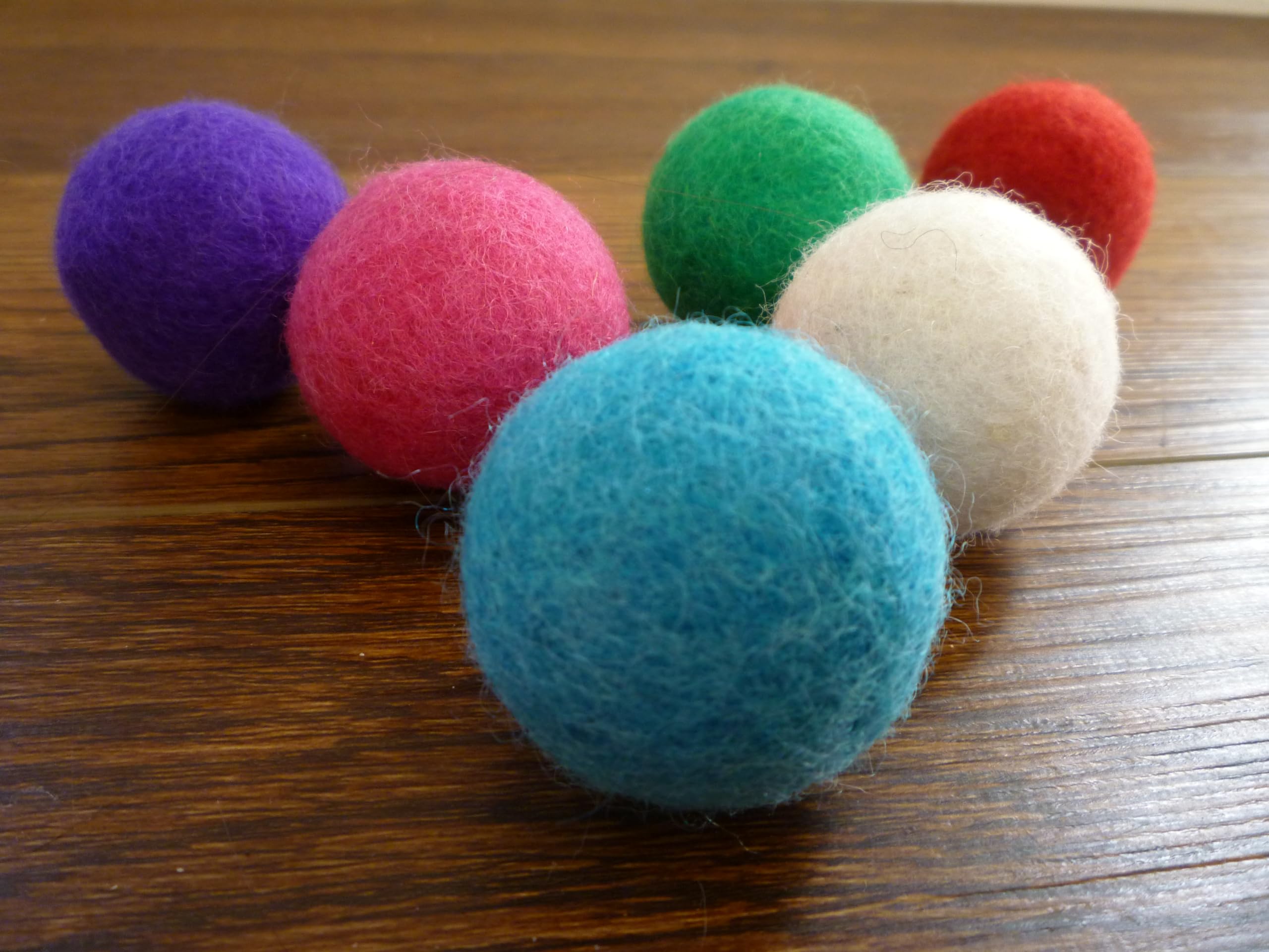 Earthtone Solutions quiet wool cat balls in action for feline play.
