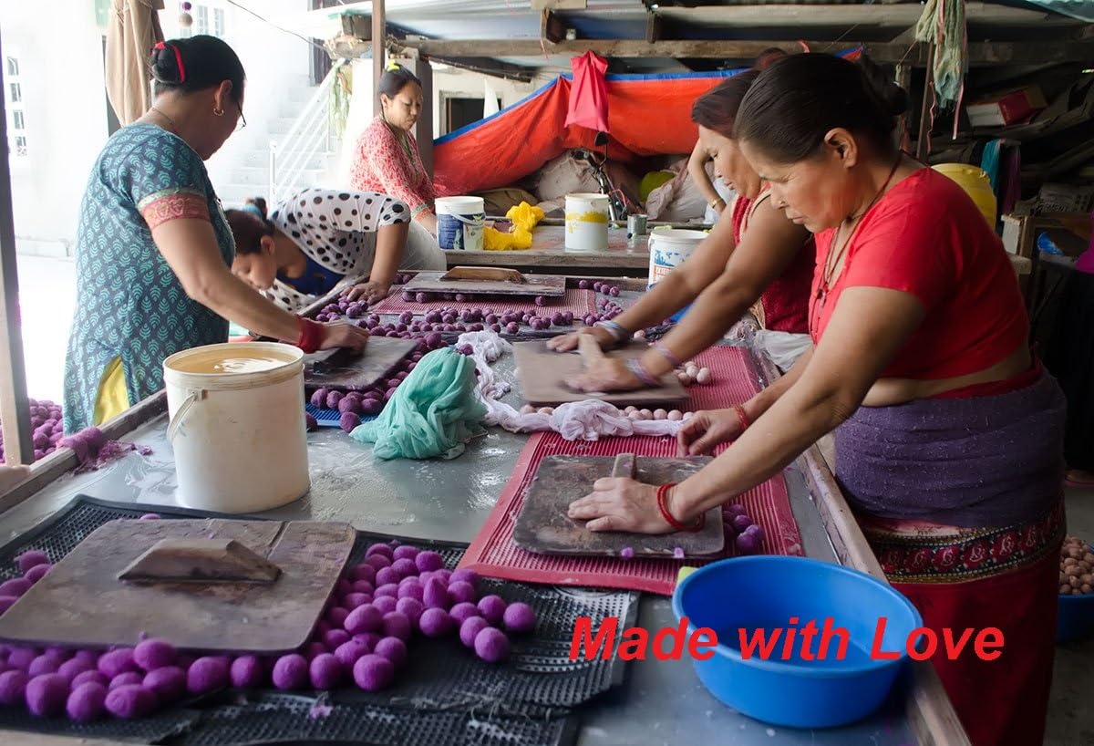 Kittens and cats enjoying tossing and batting Earthtone Solutions wool balls.