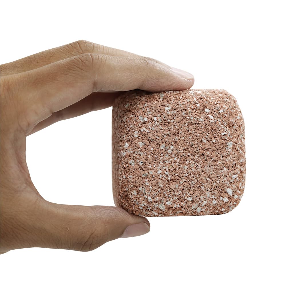 EcoBio-Block beneficial bacteria release shown mid-tank, accelerating the nitrogen cycle safely.