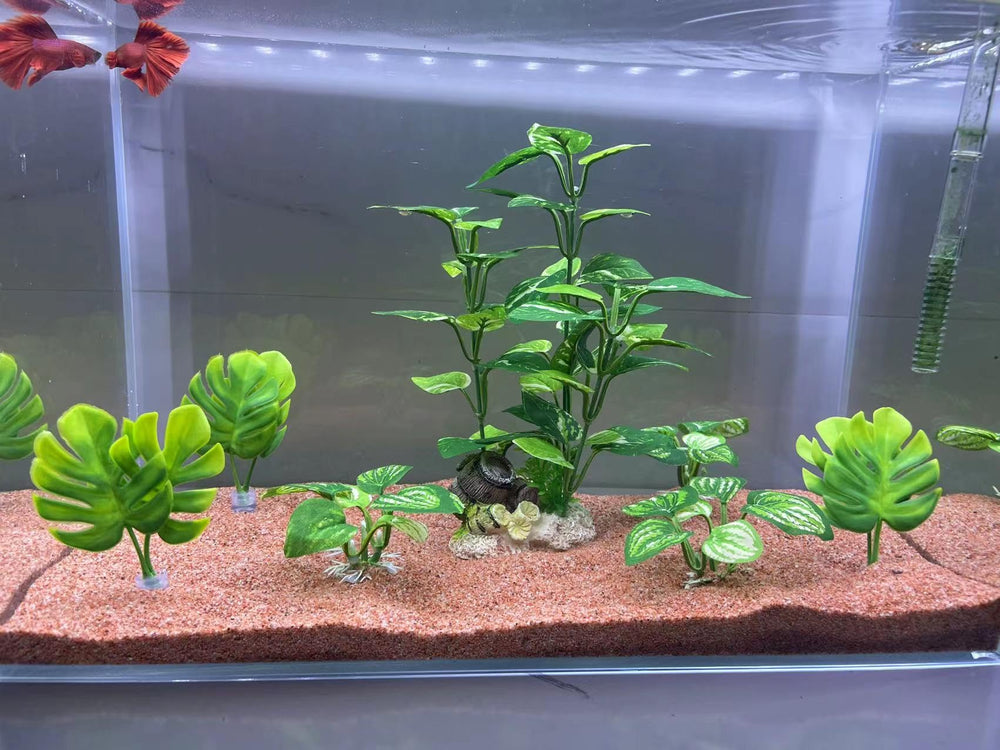 EDGCTYU silk plants pack7-green decor adds vibrant color to fish habitats.