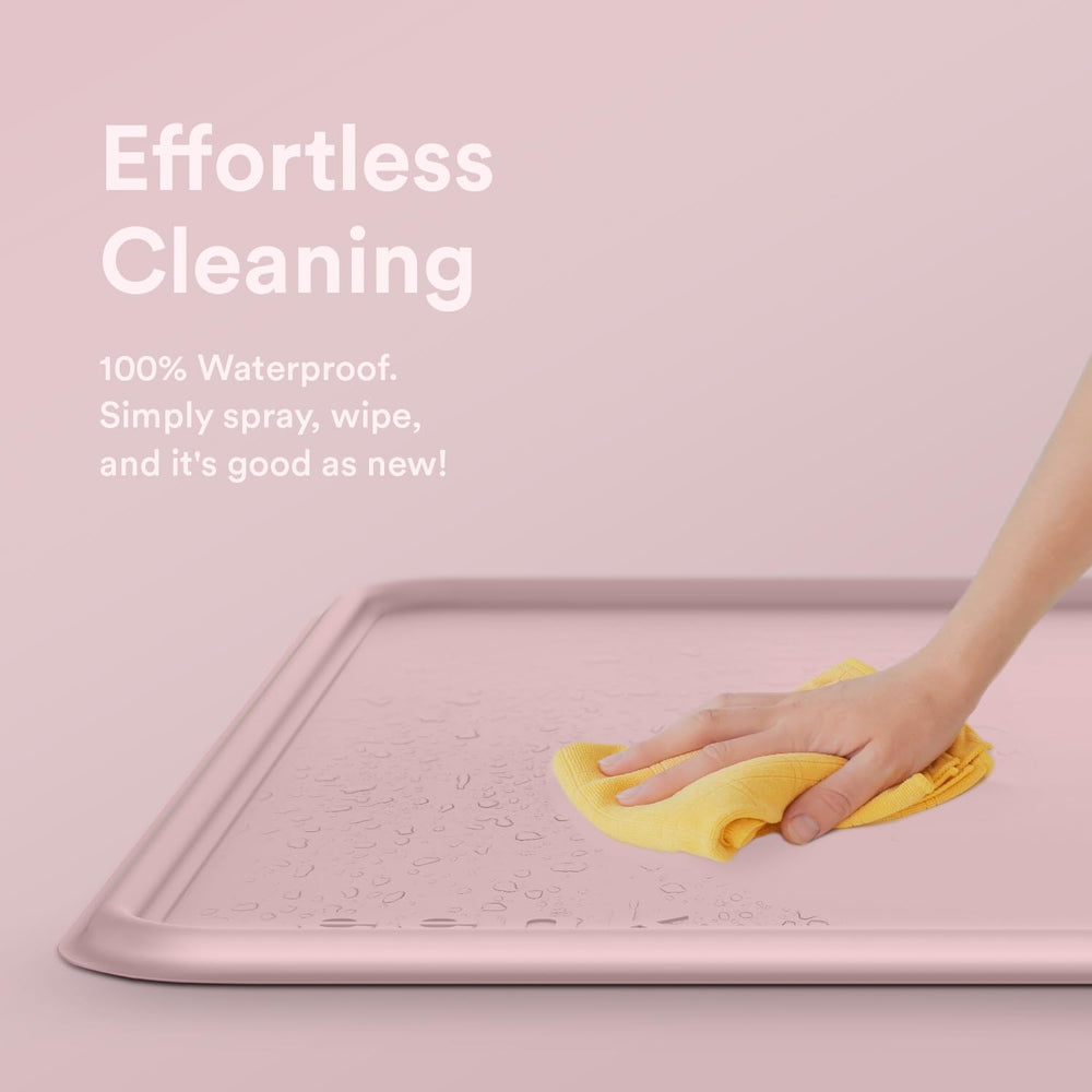 eenk pee pad tray holder in use with puppy demonstrates splash protection on floor