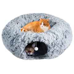 Farhming cat tunnel under the Christmas tree provides cozy winter comfort for indoor cats.