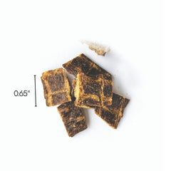 Farmland Traditions Tiny Loves Jerky Trainer dog in training with treats for positive reinforcement.