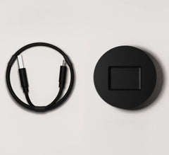 Fi Series 3 charging base recharging the smart collar at home for ongoing activity tracking.