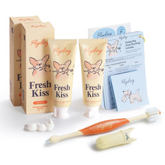 FlyDog Fresh Kiss toothpaste tube close-up shows enzymatic cleaning for dogs’ teeth.