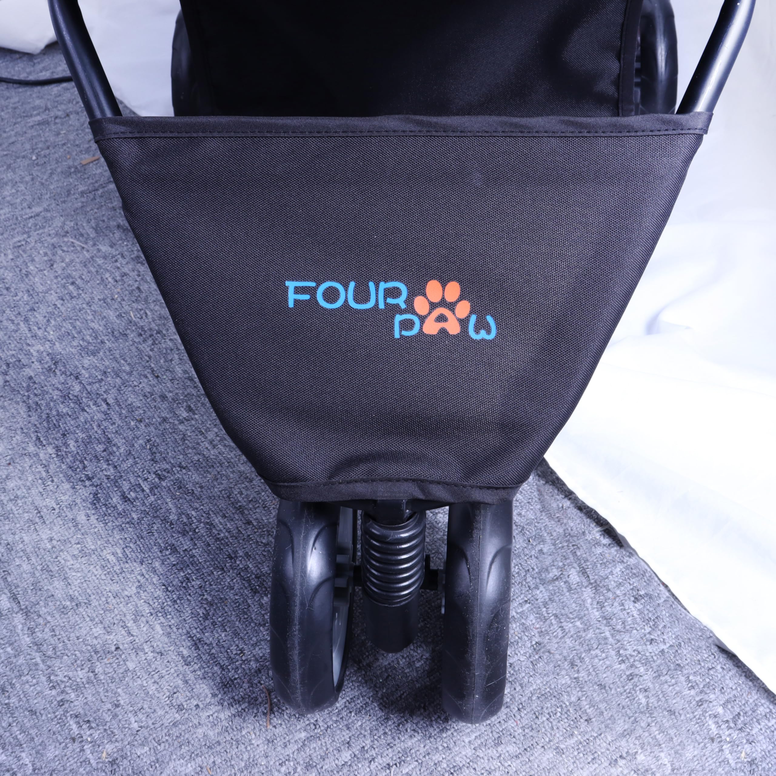 FOURPAW bottom storage basket keeps essentials close at hand.