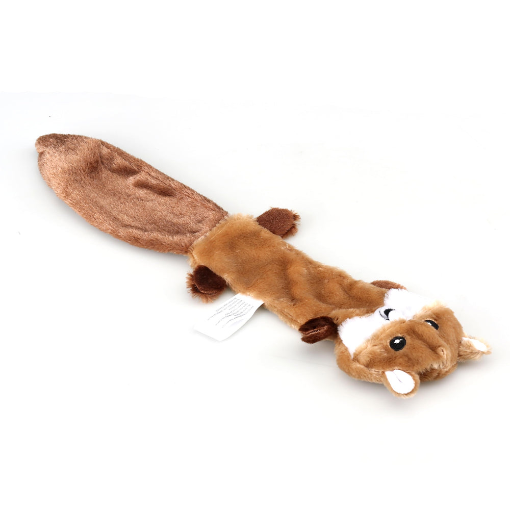 Friendly Pet dog playing with unstuffed toys demonstrates versatile texture variety.