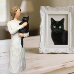 FRUMOASA cat memorial shows the black cat cradled by an angel.
