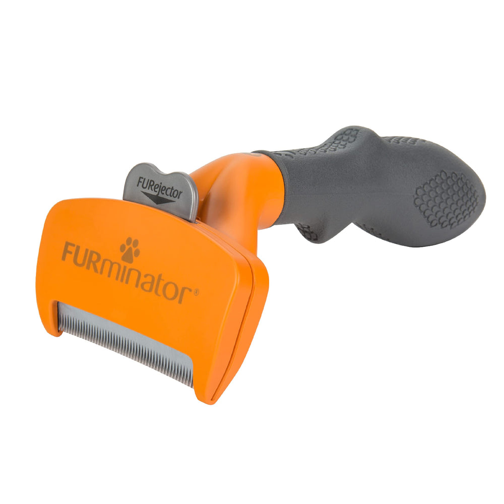 FURminator undercoat deshedding tool in use removes loose hair efficiently.
