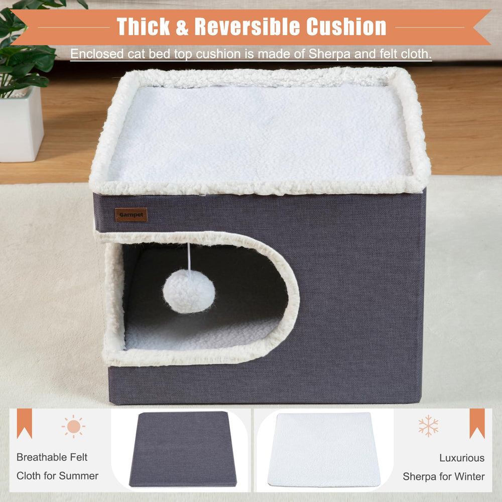 Garnpet cat bed with hanging plush ball for interactive play.