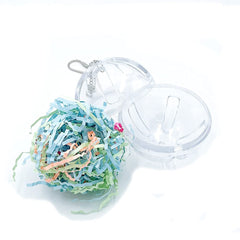 GILYGI forager ball interior with colorful shredded paper attractant.