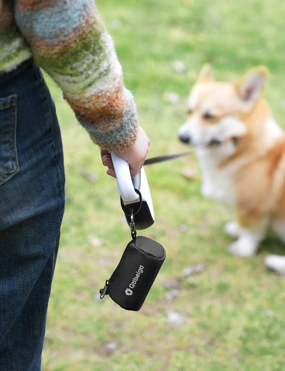 Gobeigo poop bag holder featuring loops and fasteners for stability.