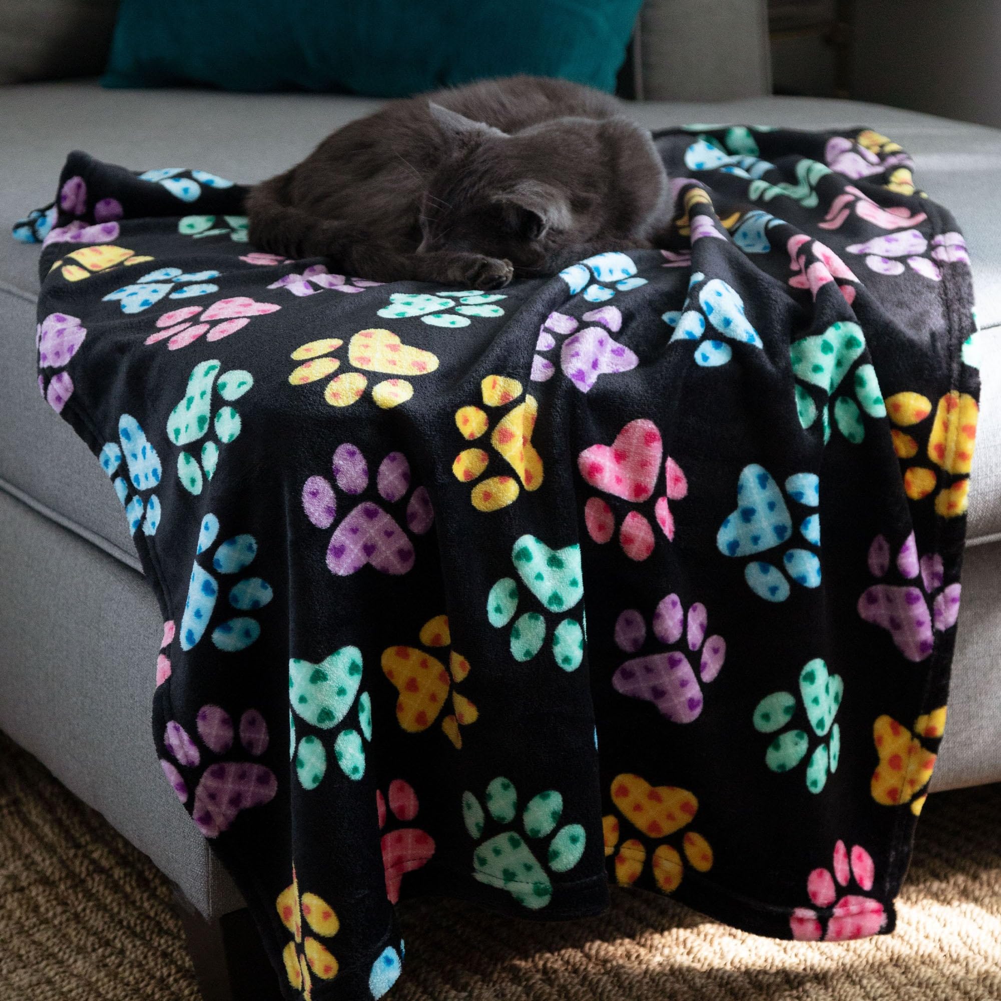 GreaterGood blanket on a sofa demonstrates versatile home use.