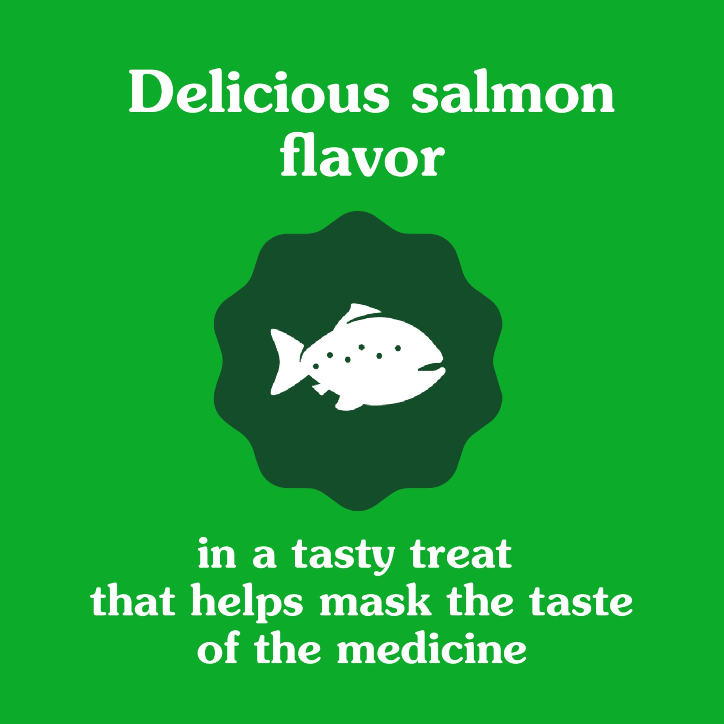 Greenies cat enjoying treat reinforces positive association with medicine time