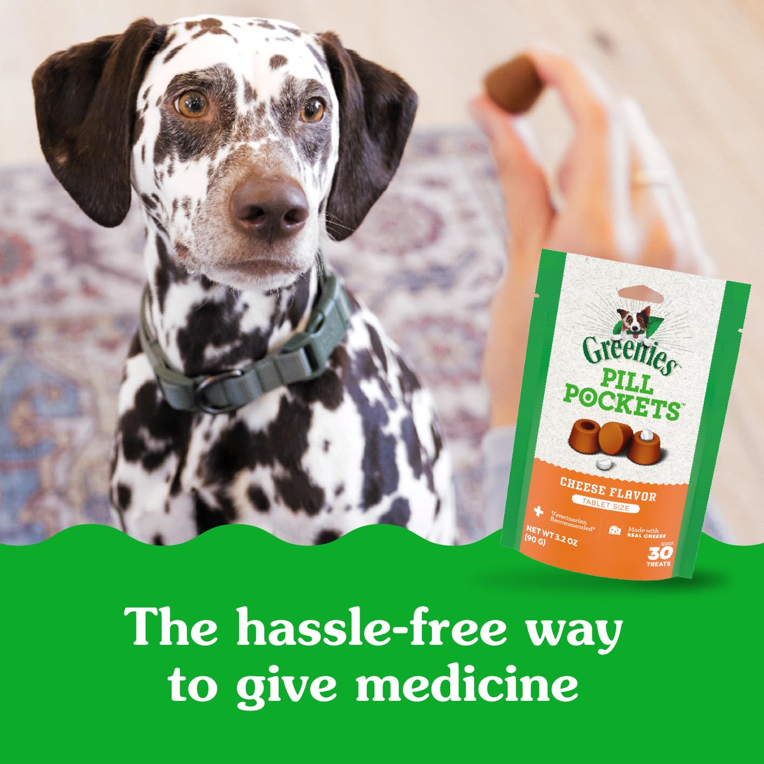 Greenies Pill Pockets small cheese treat on finger, easy to offer.