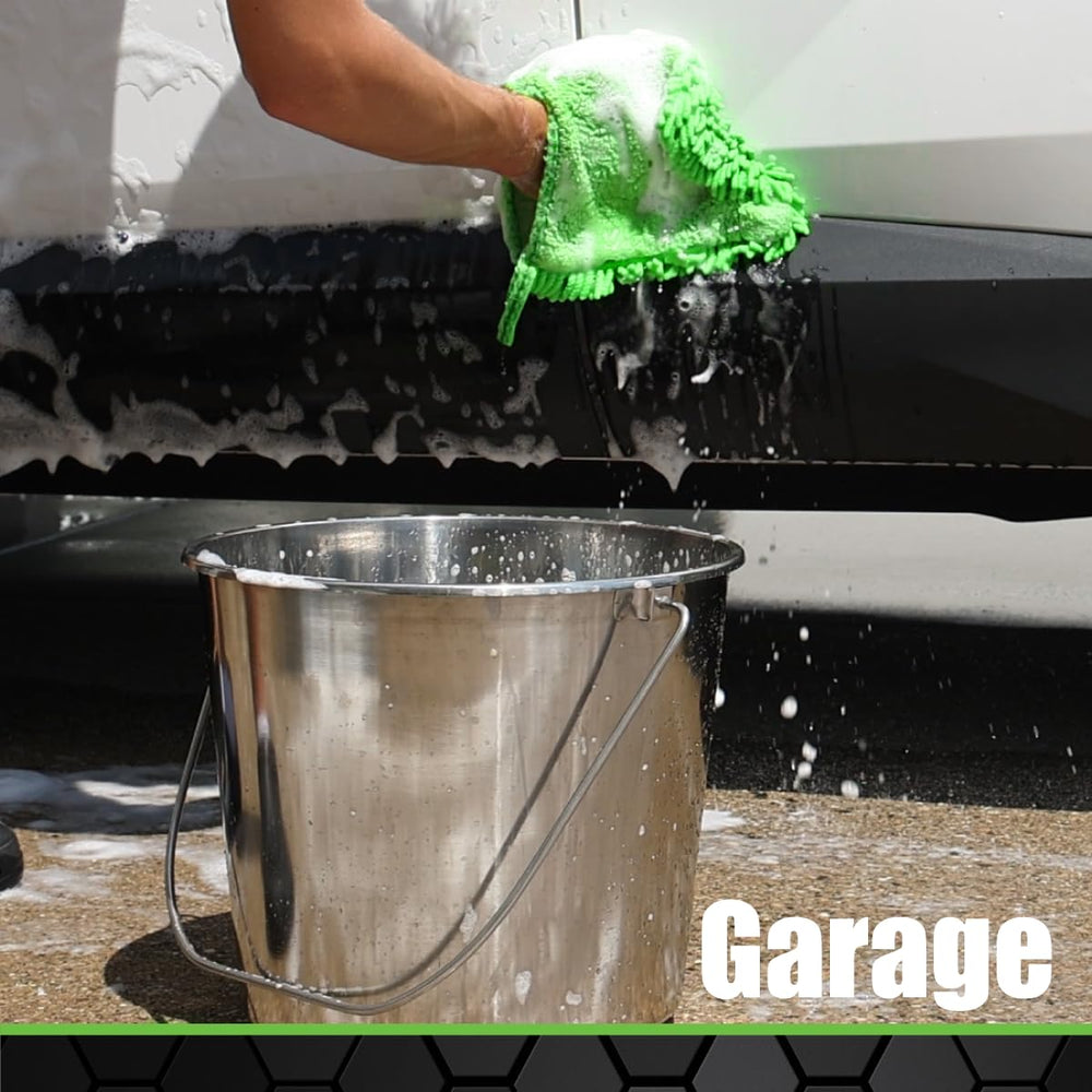 Grip stainless steel bucket in garden work—robust steel for soil rinsing.
