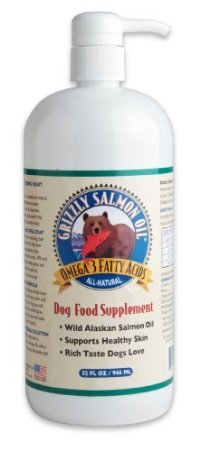 Grizzly Salmon Oil 32oz bottle being poured over dog food for easy serving.