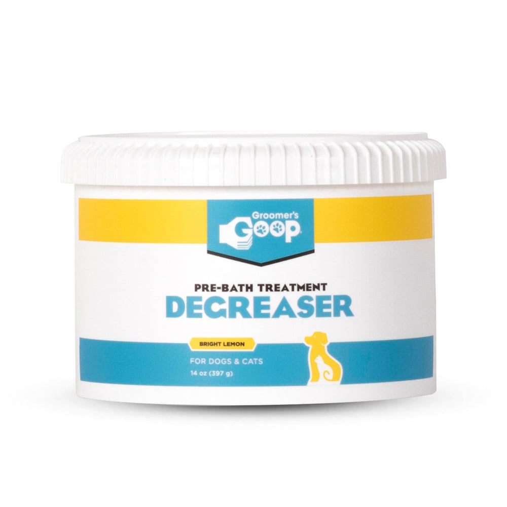 Groomer's GOOP pre-bath degreaser bottle shows professional-strength formula for oily coats.