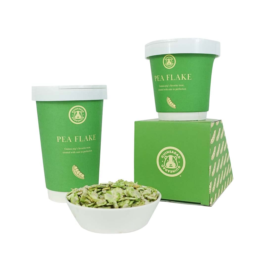 GuineaDad Pea Flakes container close-up, premium small-pet snack ready for daily treats.
