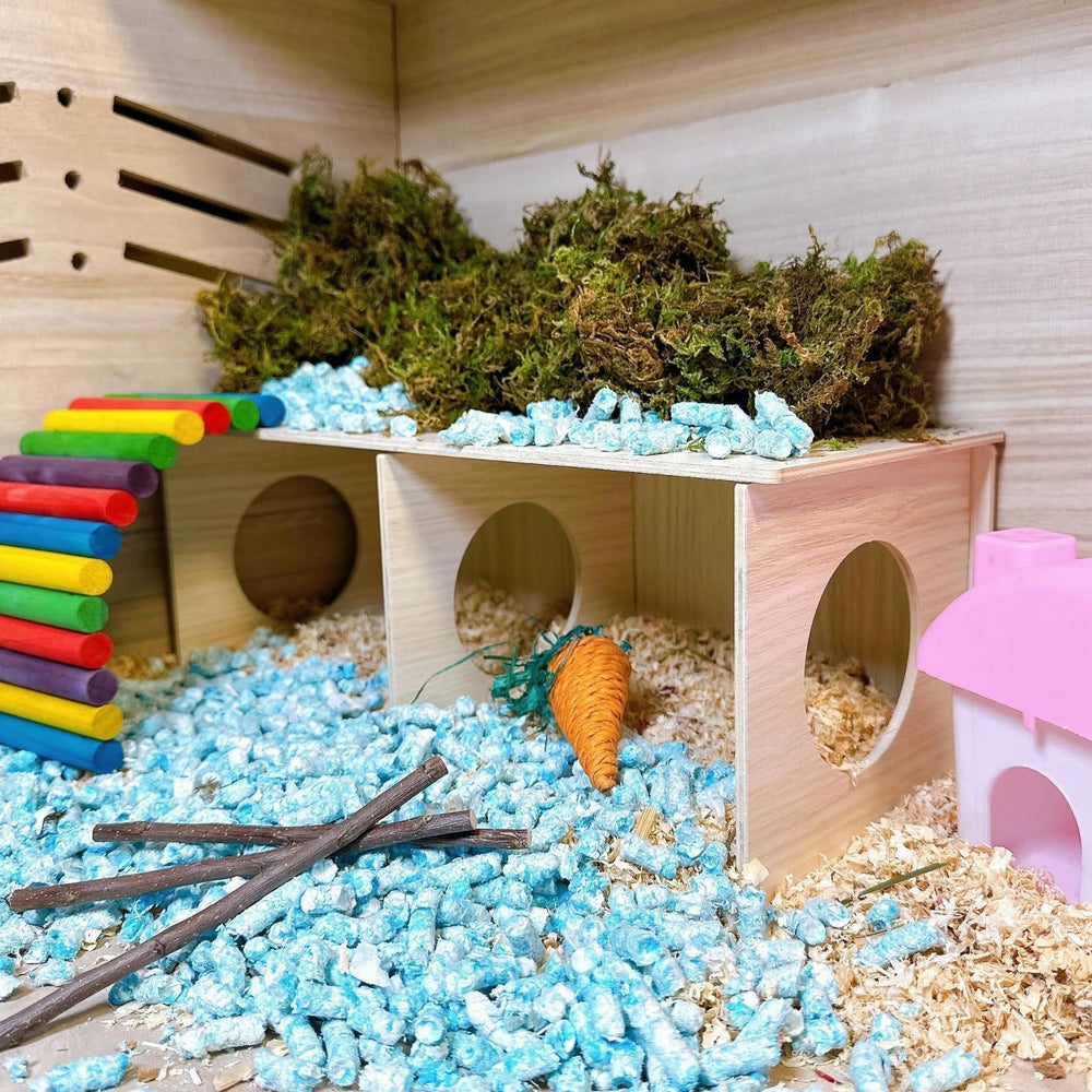 Hamiledyi wooden hideout fits beside a cage for easy monitoring.